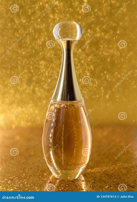 Perfume On Gold Background Stock Photo | CartoonDealer.com #244666836