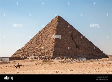 A horseman in front of the Pyramid of Menkaure, Giza pyramid complex ...