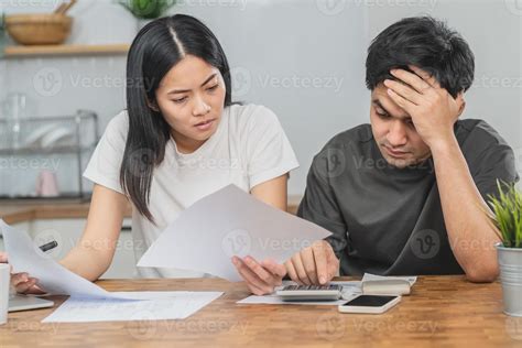 Stressed asian young couple family, wife and husband confused by