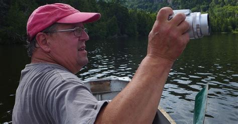 Artist Alan Bray takes a photograph from his canoe – The Woven Tale Press