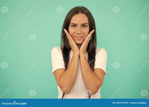 Face of Young Woman in White Shirt on Blue Background Stock Image ...