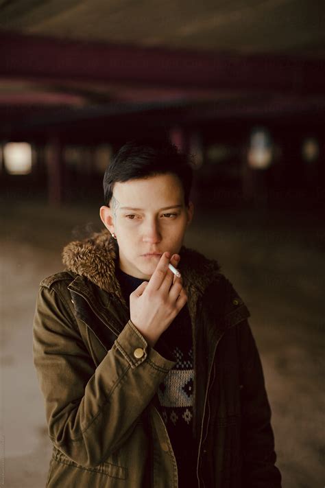 "Real Lesbian Girl Smoking On The Parking Area" by Stocksy Contributor
