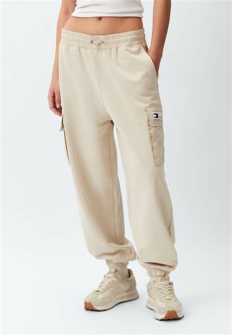 Брюки спортивные Tommy Jeans, цвет: бежевый, RTLADJ086401 — купить в ...