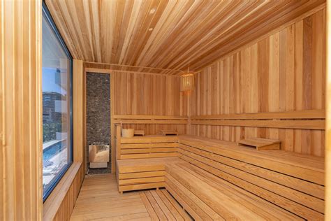 Interior of Finnish sauna, classic wooden sauna with hot steam. Russian