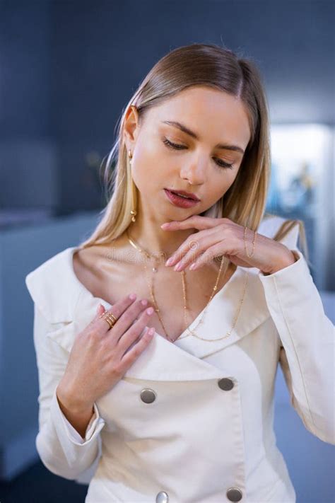 gorgeous girl   white jacket  flawless skin   face holds