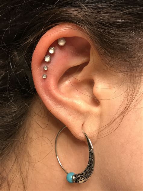 Set of five helix piercings with flat-back moonstone studs. | Helix ...
