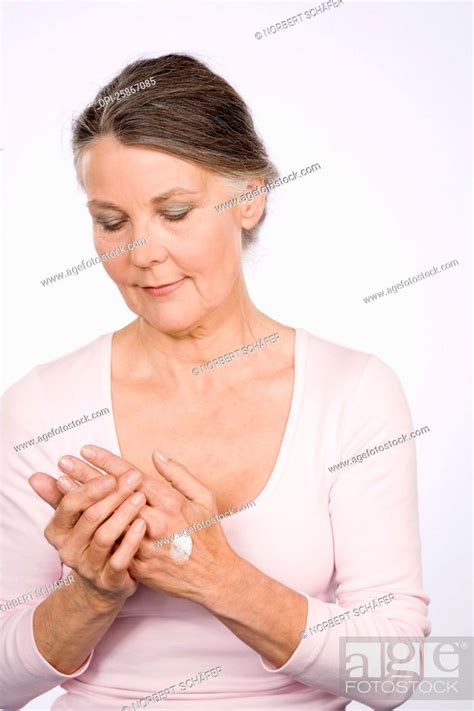 Woman Moisturizing Hands, Stock Photo, Picture And Royalty Free Image ...