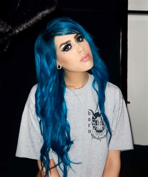 Download Vibrant_ Blue_ Hair_ Scene_ Style Wallpaper | Wallpapers.com