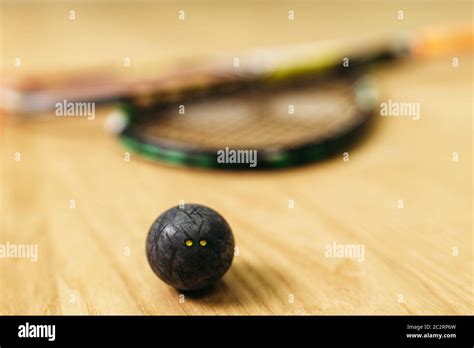 Squash game concept, racket and ball closeup view. Sport equipment on ...