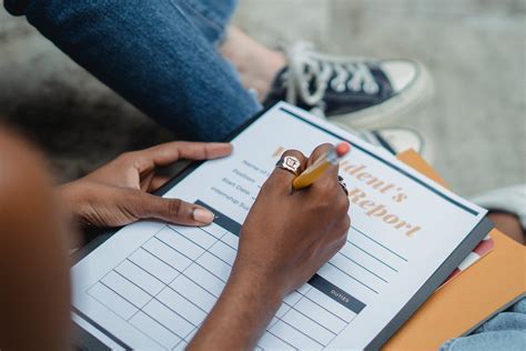 crop student writing report  pencil  stock photo