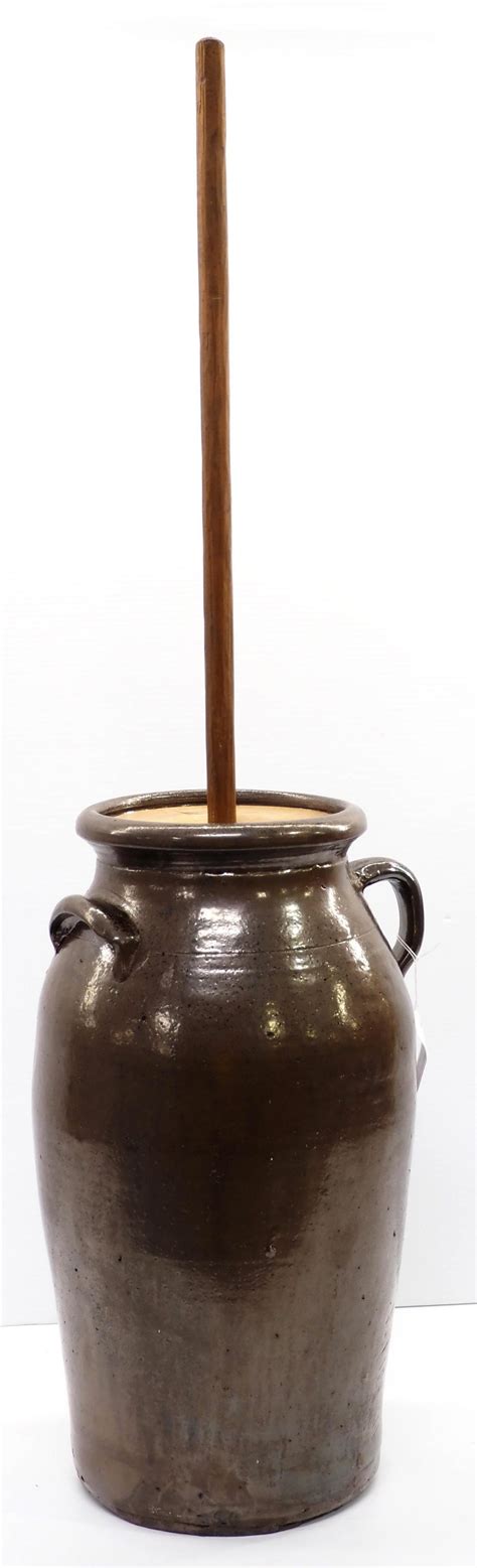 At Auction: Unusual crock butter churn