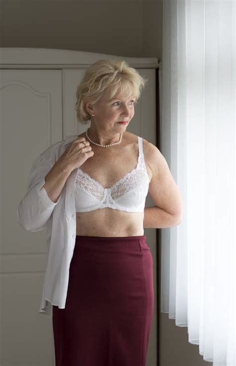 Woman getting dressed stock image. Image of woman, putting - 57017861