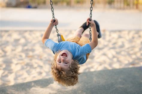 swinging  playground happy child enjoy swinging kid swinging stock