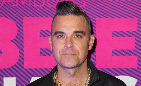 Fans wonder how old is robbie williams after his high energy set 25