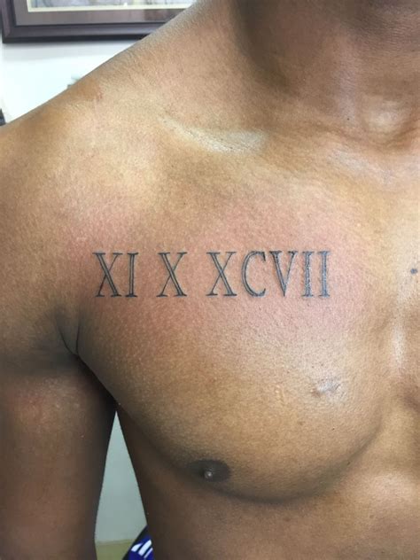 roman numerals chest tattoo 3