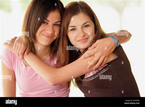 Two friends hugging Stock Photo - Alamy