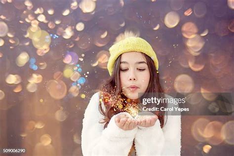 blowing glitter woman   premium high res pictures getty images