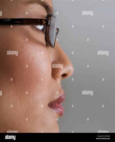 Profile view of woman wearing glasses Stock Photo - Alamy