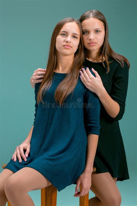 Portrait of Two Beautiful Twin Young Women Stock Photo - Image of ...