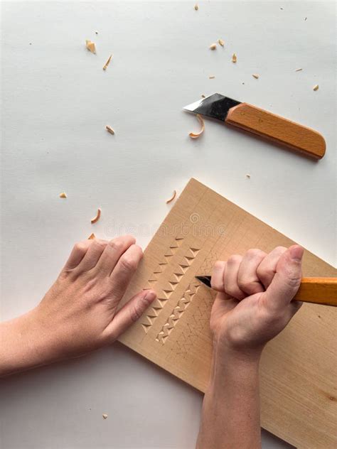 Intricate Wood Carving with Hand Tools on Light Surface Stock Image ...