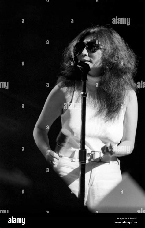 Yoko Ono singing in a charity concert in New York with her husband John ...