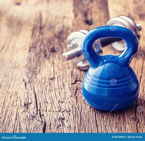 Fitness Equipment. Kettlebell Dumbbells Towel Water and Measuring Tape