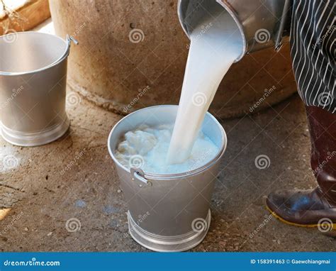 Milk Being Poured Into A Glass Of Iced Coffee Stock Photo ...