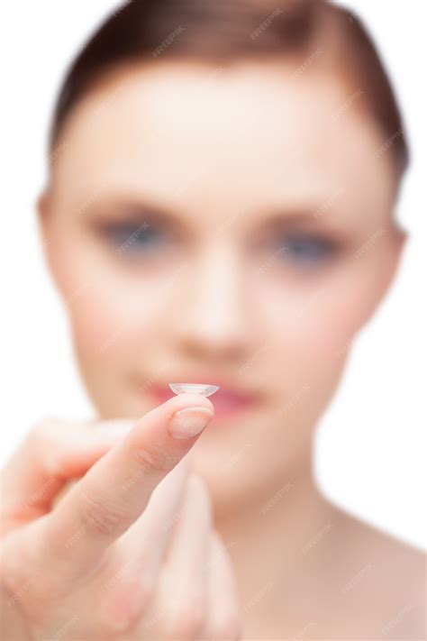 Premium Photo | Gorgeous nude model holding contact lens