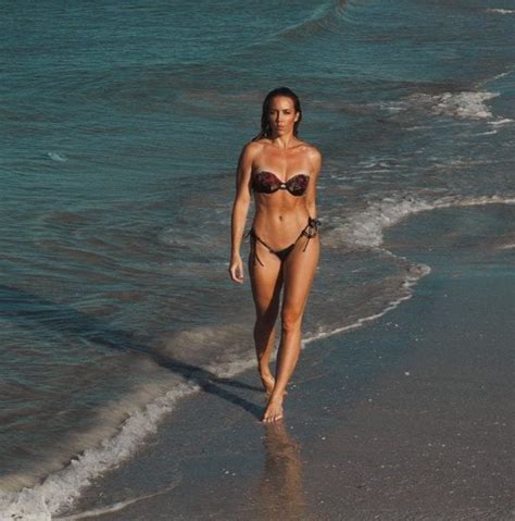 Chelsea Green Stuns While Strolling On The Beach In New Photos