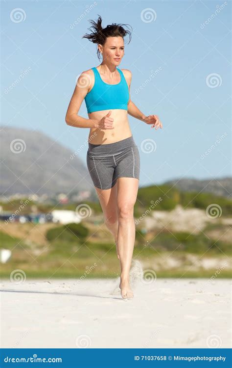 Fitness Woman Running Barefoot On The Beach Stock Photo - Image of person, fitness: 71037658