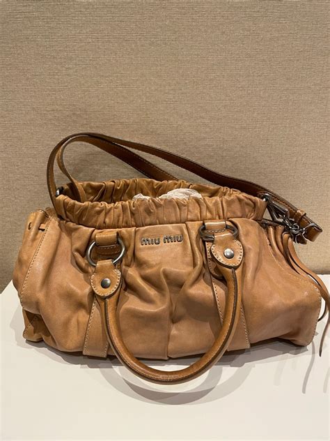 Miu Miu beige leather gathered bag, Women's Fashion, Bags & Wallets ...