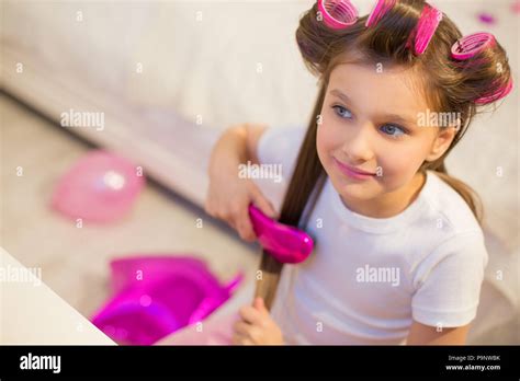 cute girl brushing  hair stock photo alamy