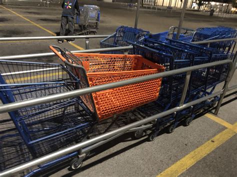 Meijer, Kroger, PetsMart and Big Lots carts in a Walmart cart return