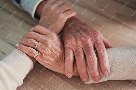 Premium Photo | Close up view of seniors people holding hands together ... 