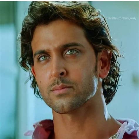 close    man  curly hair  blue eyes    camera