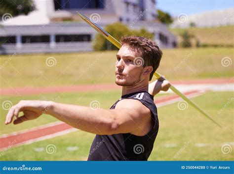 This is Going the Distance. Shot of a Lone Man Throwing a Javelin ...