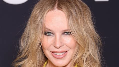 Kylie Minogue puts on a very cheeky display in see-through suit and ...