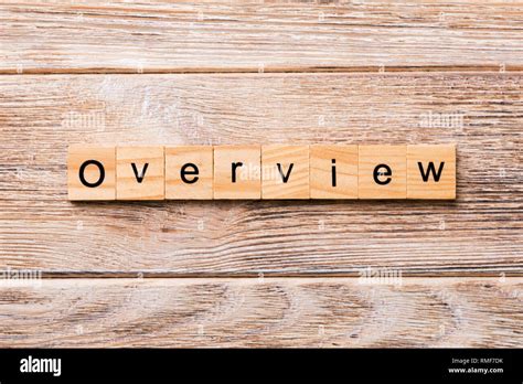 overview word written  wood block overview text  wooden table