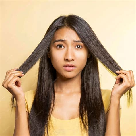 Premium Photo | Damaged hair isolated on yellow background Dry and