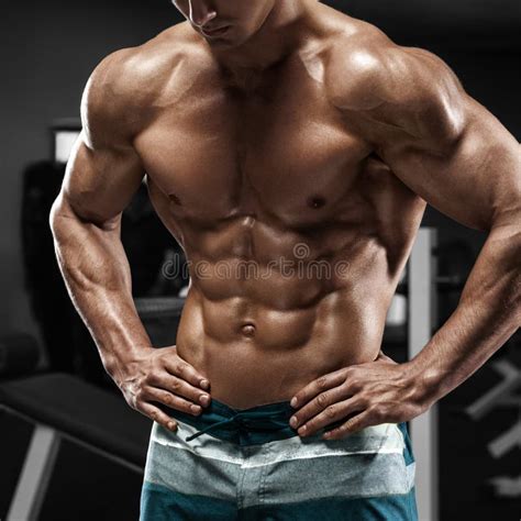 Muscular Man Abs in Gym, Shaped Abdominal. Strong Male Naked Torso