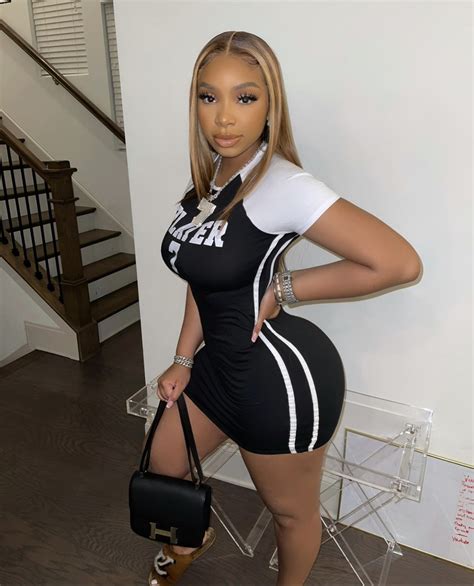 LightSkinKeisha Posed in Black and White Sports-Inspired Mini Dress