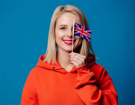 Premium Photo | Beatiful girl holds british flag in hand