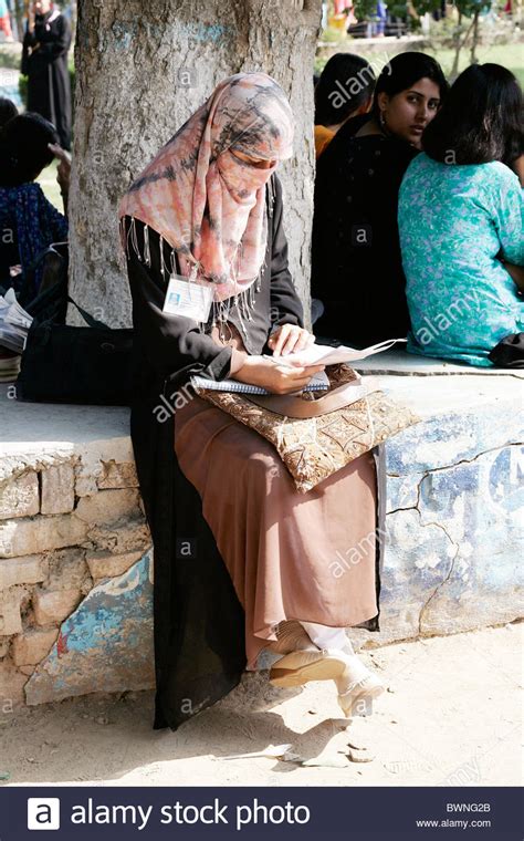 student sits reading    female fatima jinnah university