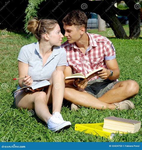 Happy Couple In Love Studying With Books In Park Stock Photo - Image