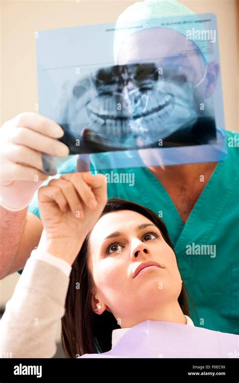 Dentist showing x-ray to his patient Stock Photo - Alamy