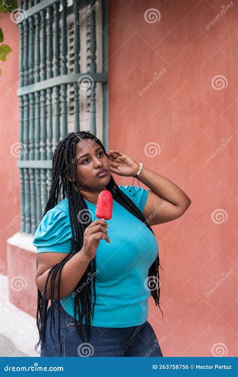 Mixed Woman Eating Popsicle on the Street Stock Photo - Image of cool ...
