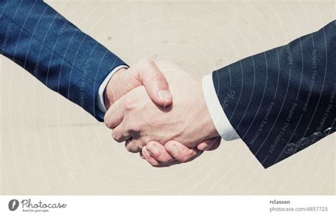 business man hand shake deal - a Royalty Free Stock Photo from Photocase