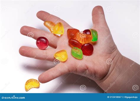 Hand and gummy bears. stock image. Image of jelly, sweet - 212418067