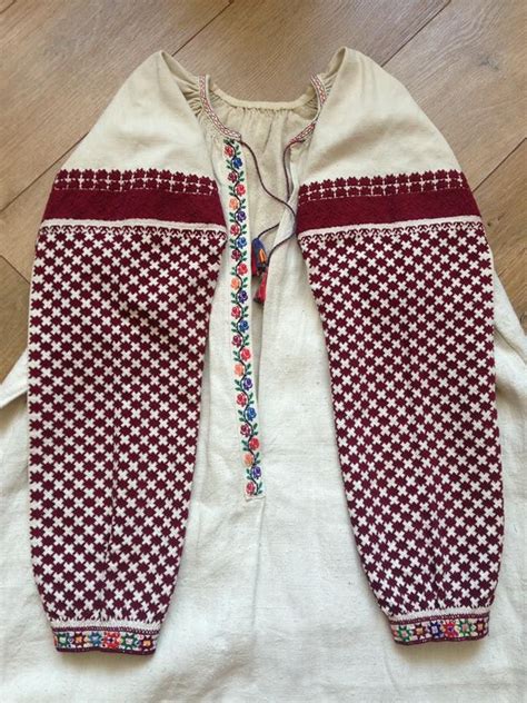 Embroidered White Shirt with Red and Blue Patterns