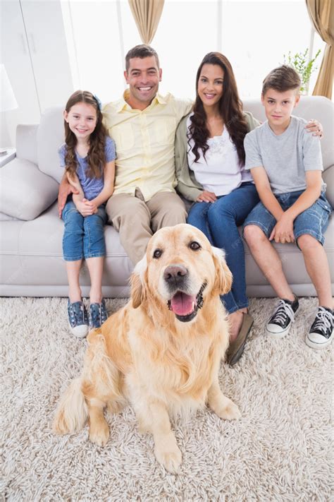 Premium Photo | Portrait of smiling family with Golden Retriever